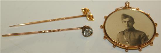 2 gold tie pins & a locket